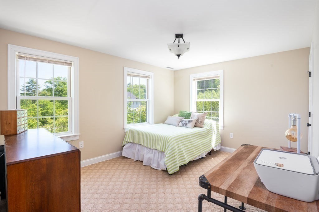 1 Timber Lane, Unit B Amesbury, MA 01913 - Photo 21 of 41 a bedroom with a bed and a window
