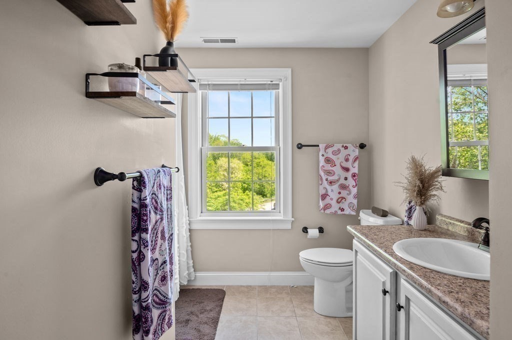 1 Timber Lane, Unit B Amesbury, MA 01913 - Photo 23 of 41 a bathroom with a granite countertop sink toilet and shower