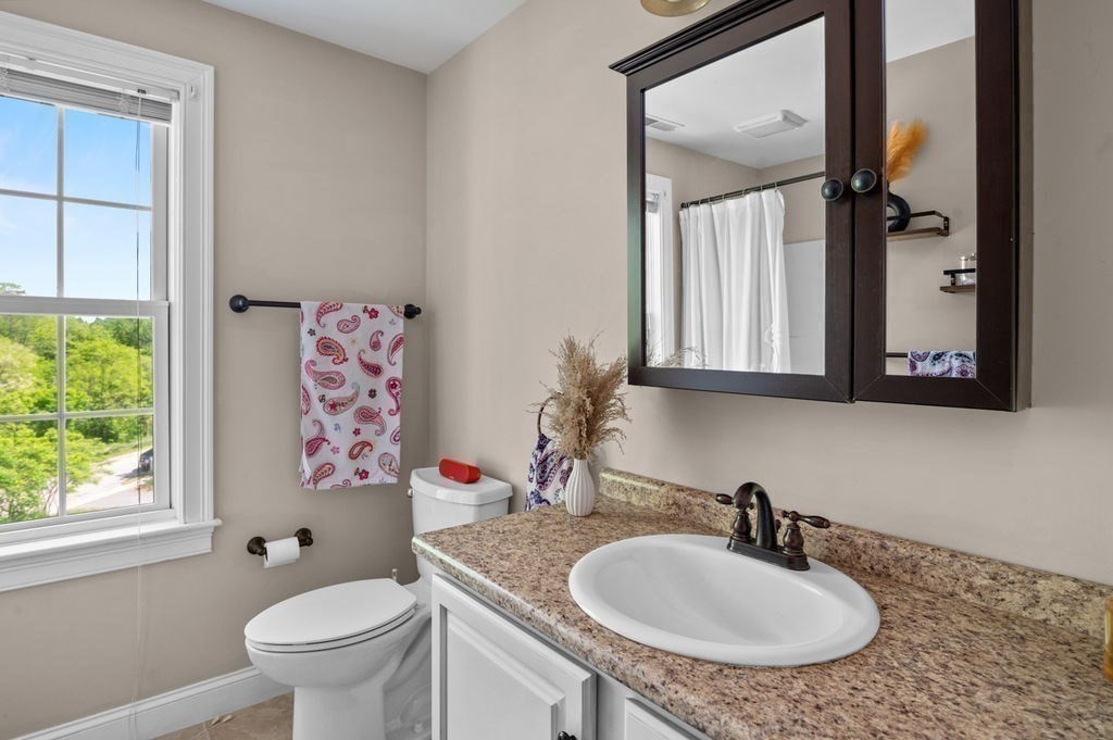 1 Timber Lane, Unit B Amesbury, MA 01913 - Photo 24 of 41 a bathroom with a sink and a mirror