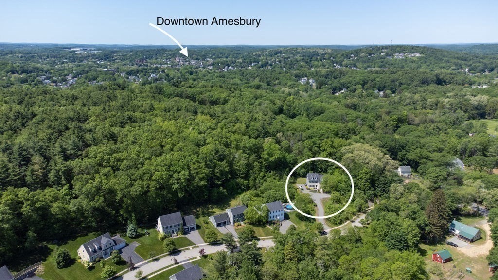 1 Timber Lane, Unit B Amesbury, MA 01913 - Photo 30 of 41 an aerial view of a house with a swimming pool