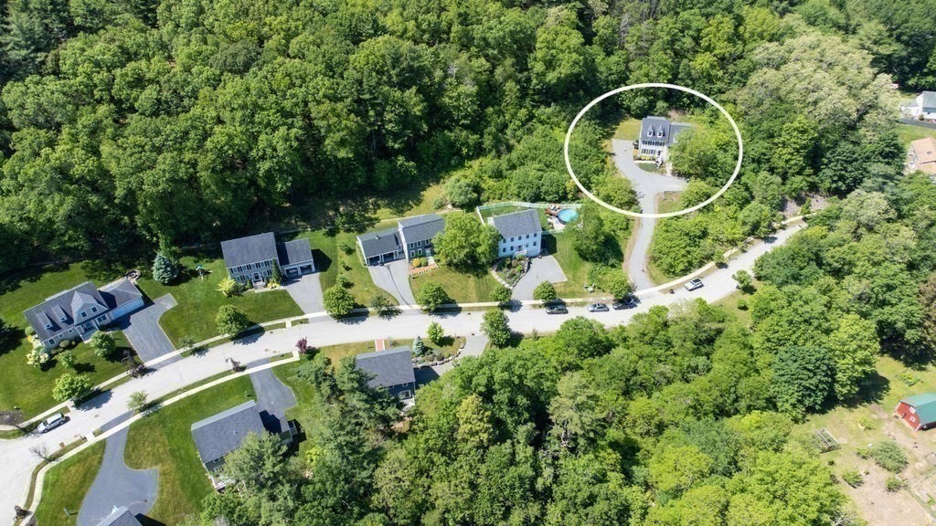1 Timber Lane, Unit B Amesbury, MA 01913 - Photo 31 of 41 an aerial view of a house with a swimming pool