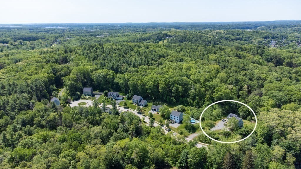 1 Timber Lane, Unit B Amesbury, MA 01913 - Photo 34 of 41 an aerial view of a house with a yard and large trees