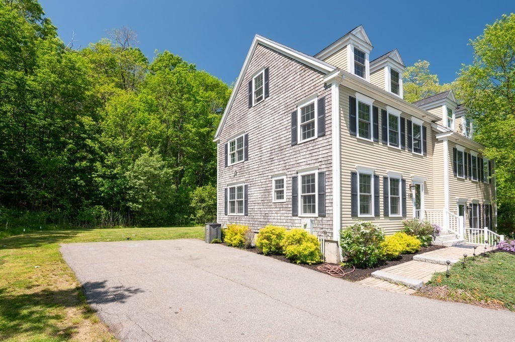 1 Timber Lane, Unit B Amesbury, MA 01913 - Photo 37 of 41 a front view of a house with garden