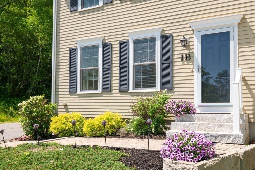 1 Timber Lane, Unit B Amesbury, MA 01913 - Photo 39 of 41 a view of a potted plant sitting in front of a house