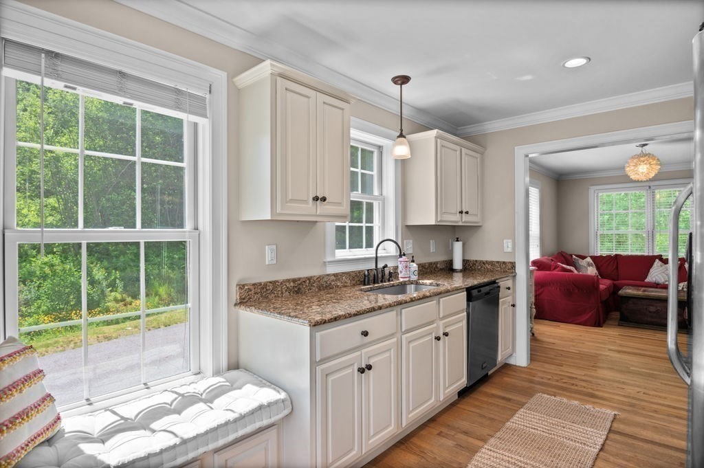 1 Timber Lane, Unit B Amesbury, MA 01913 - Photo 4 of 41 a kitchen with a sink stove and cabinets