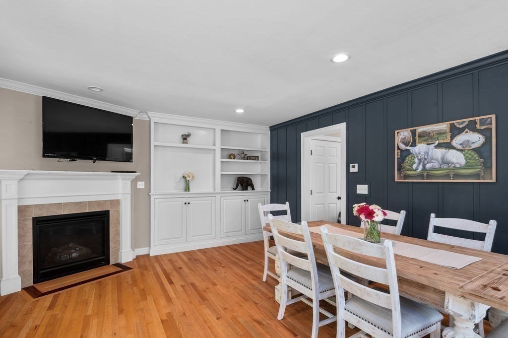 1 Timber Lane, Unit B Amesbury, MA 01913 - Photo 7 of 41 a living room with furniture a fireplace and a flat screen tv