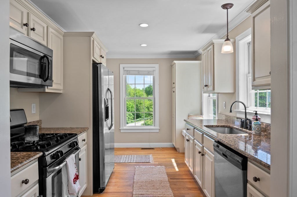 1 Timber Lane, Unit B Amesbury, MA 01913 - Photo 10 of 41 a kitchen with granite countertop a sink stove and refrigerator