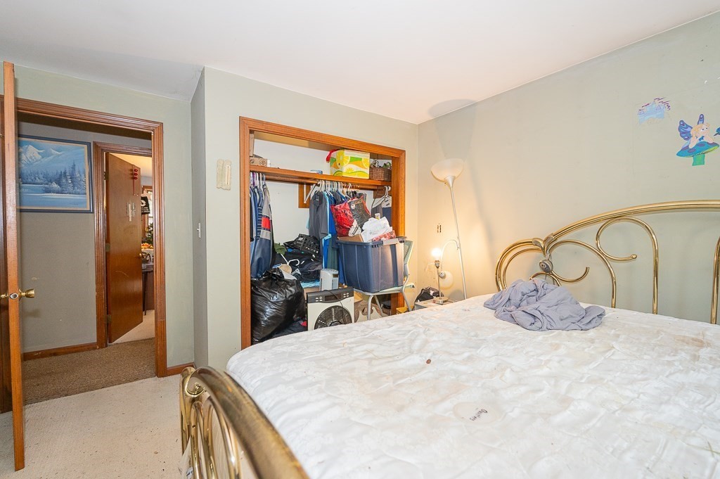 172 North Brookfield Road Oakham, MA 01068 - Photo 11 of 26 a bedroom with a bed and a large mirror on the dresser
