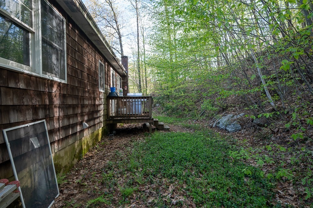 172 North Brookfield Road Oakham, MA 01068 - Photo 24 of 26 a view of backyard with deck and outdoor seating