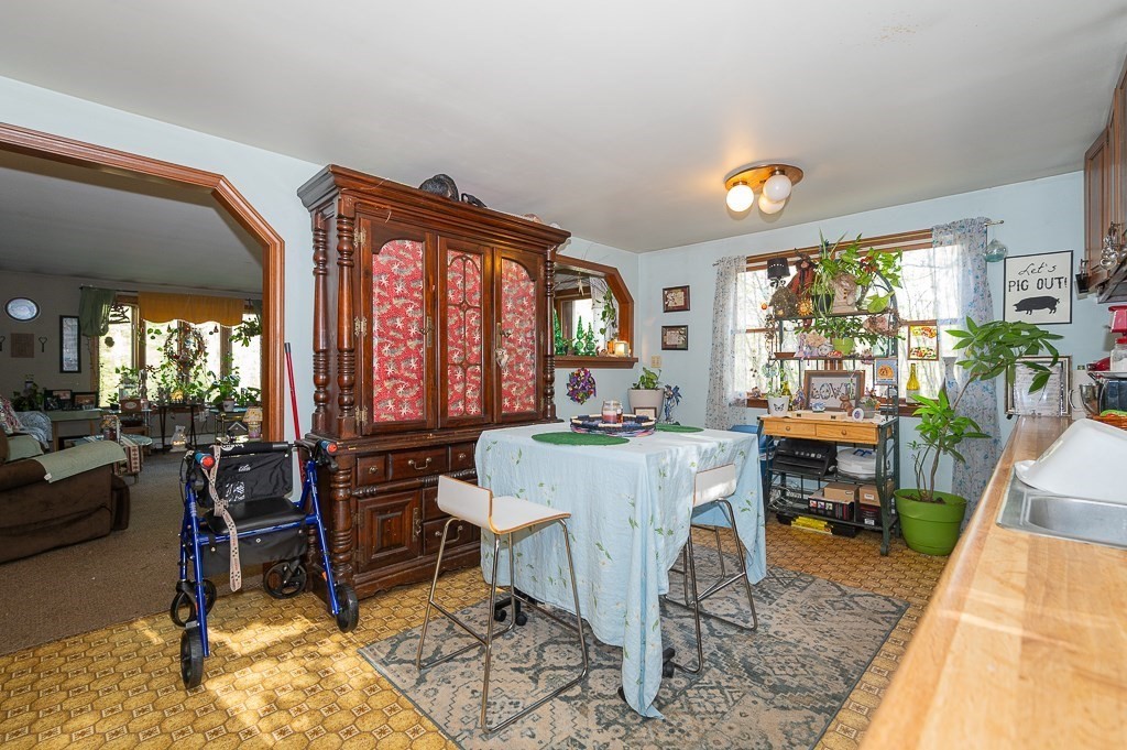 172 North Brookfield Road Oakham, MA 01068 - Photo 6 of 26 a view of a dining room with furniture window and outside view