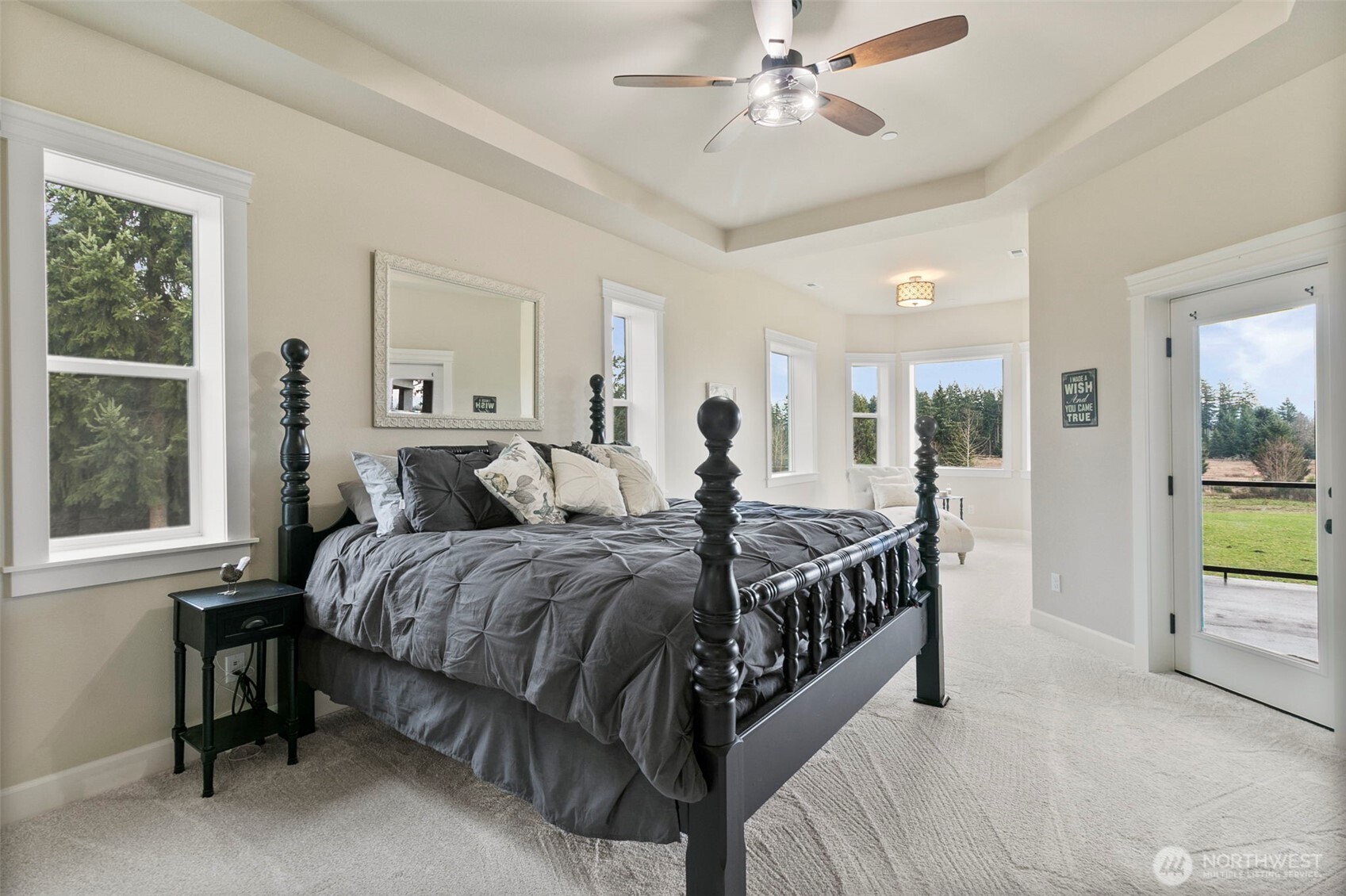 31619 26th Avenue East Graham, WA 98338 - Photo 17 of 40 a bed sitting in a bedroom next to a window