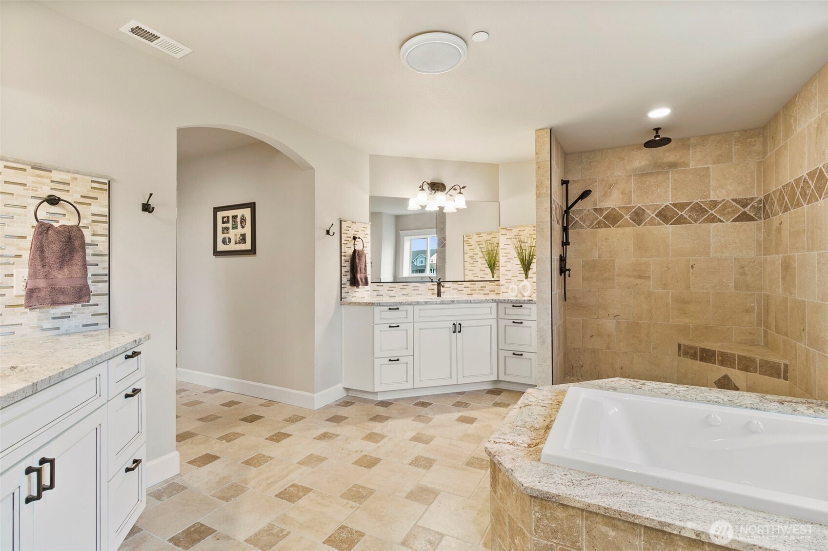 31619 26th Avenue East Graham, WA 98338 - Photo 18 of 40 a bathroom with a bathtub sink and a mirror