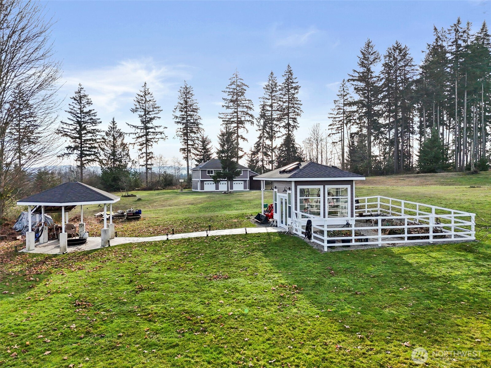 31619 26th Avenue East Graham, WA 98338 - Photo 30 of 40 a view of a house with a yard table and chairs
