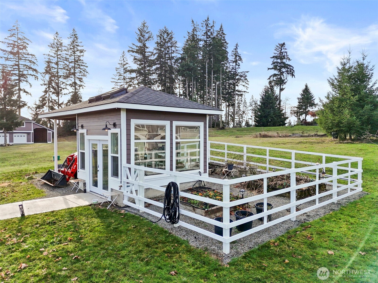 31619 26th Avenue East Graham, WA 98338 - Photo 31 of 40 a view of a house with a yard and sitting area