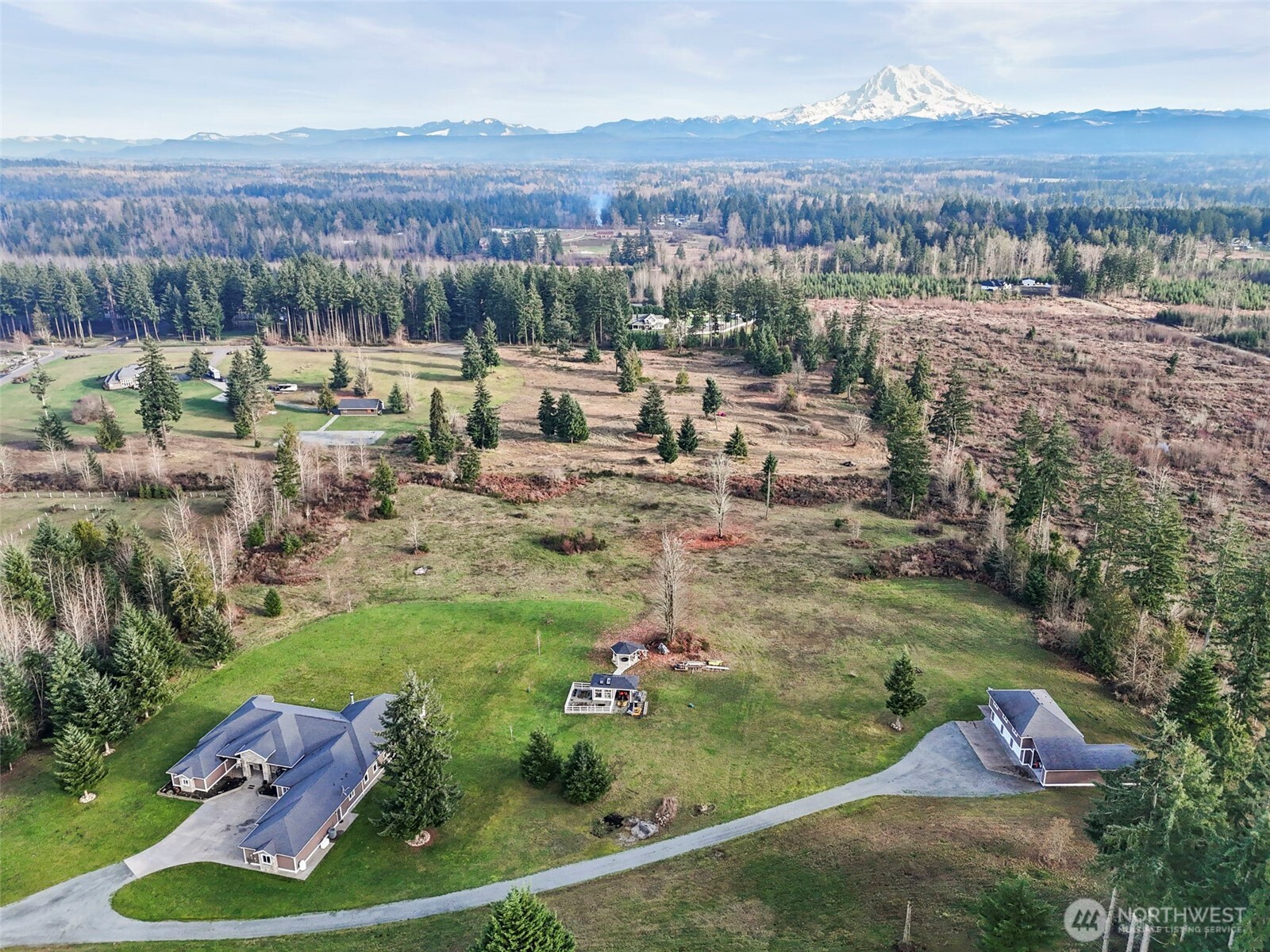 31619 26th Avenue East Graham, WA 98338 - Photo 35 of 40 an aerial view of a house with a yard and lake view