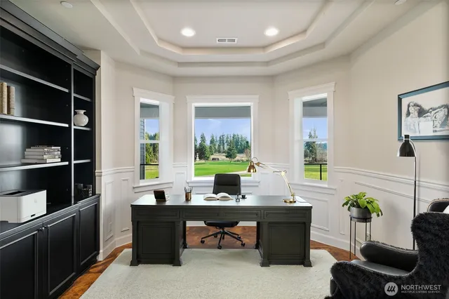 a workspace with furniture and window