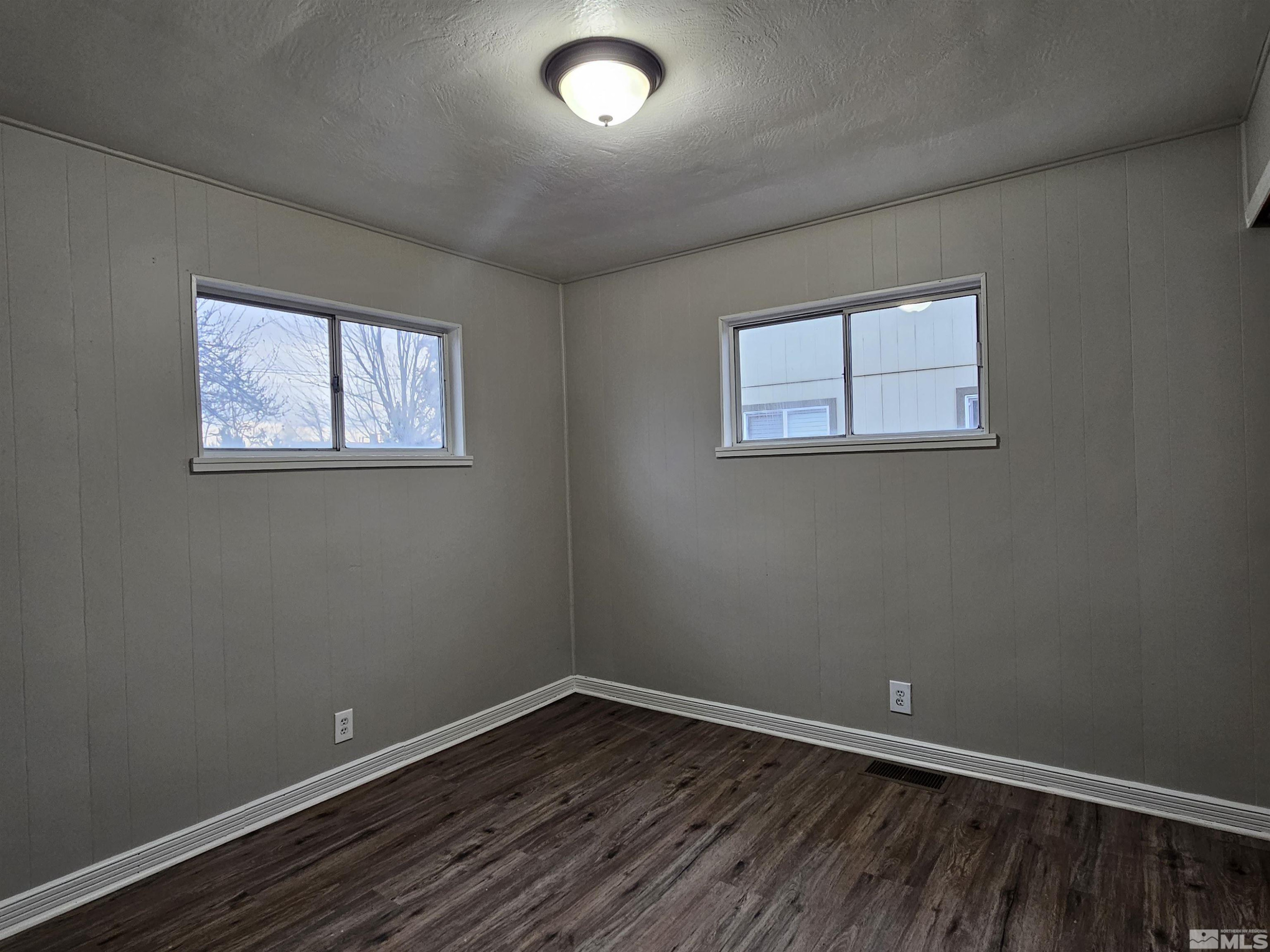 1970 Citron Street Reno, NV 89512 - Photo 10 of 15 an empty room with wooden floor and windows