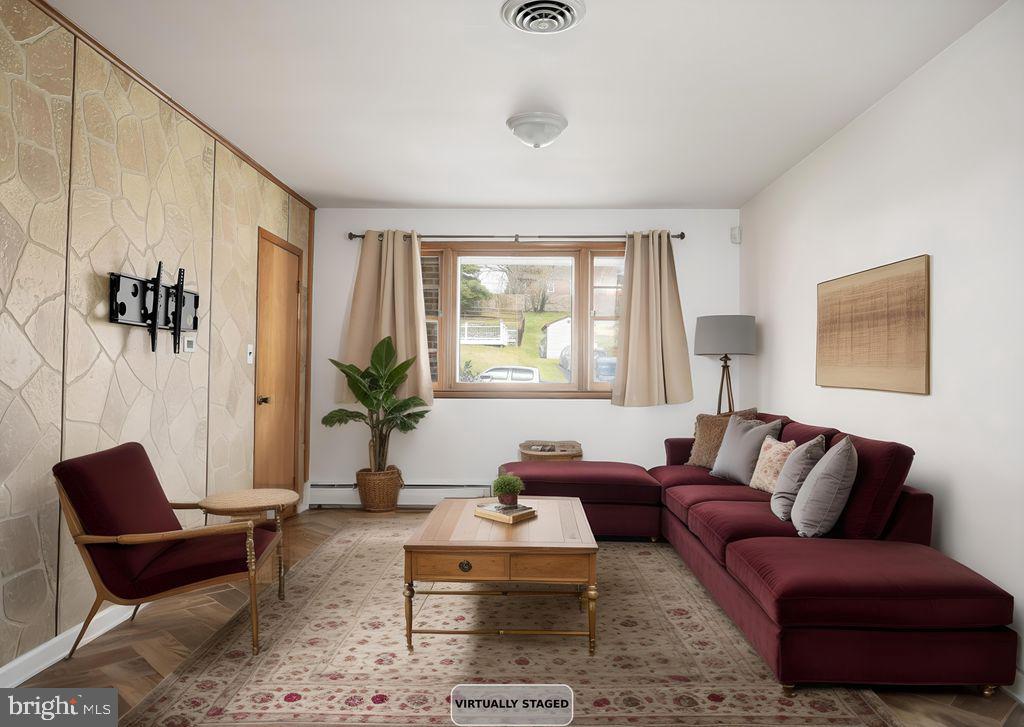 8007 Sagramore Road Baltimore, MD 21237 - Photo 18 of 41 a living room with furniture and a potted plant