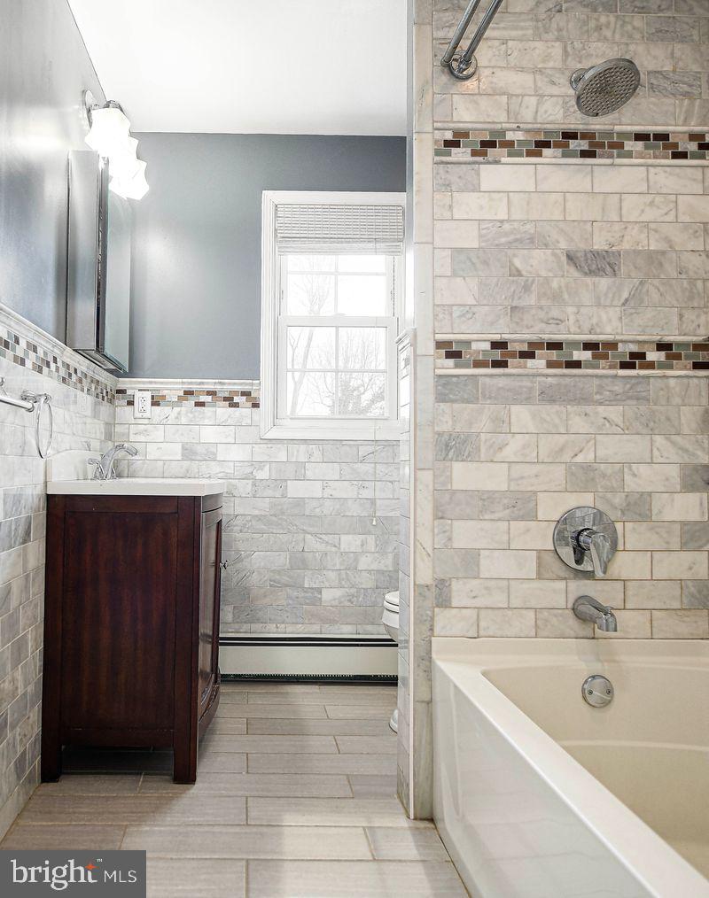 8007 Sagramore Road Baltimore, MD 21237 - Photo 26 of 41 a bathroom with a bathtub and a sink