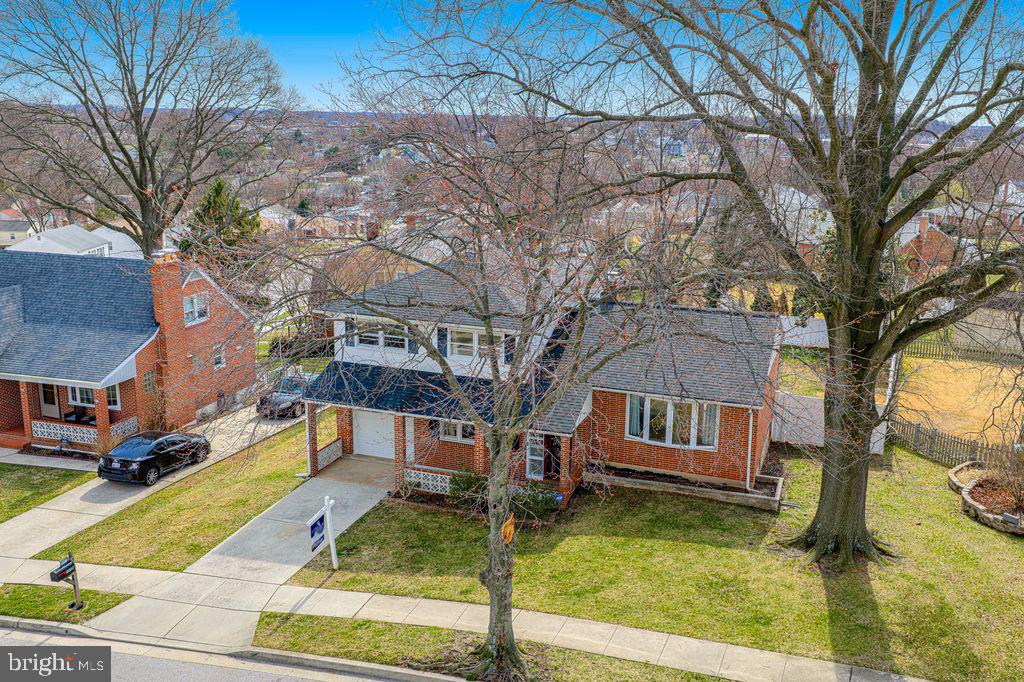 8007 Sagramore Road Baltimore, MD 21237 - Photo 36 of 41 a front view of a house with garden