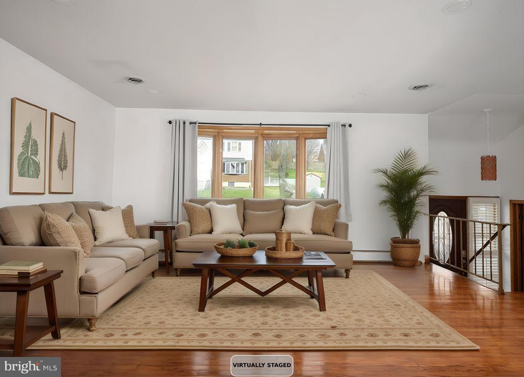 8007 Sagramore Road Baltimore, MD 21237 - Photo 6 of 41 a living room with furniture a window and a potted plant