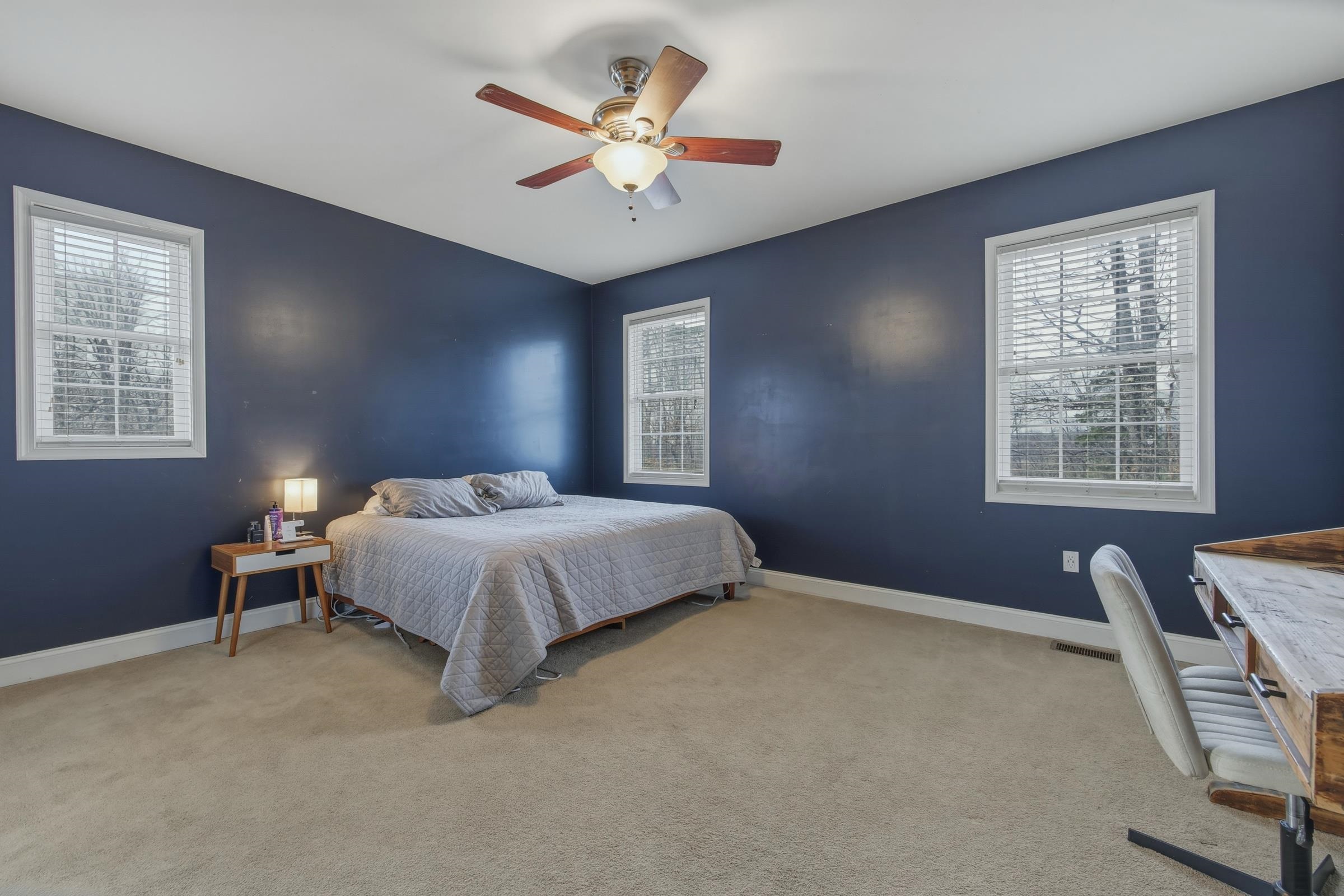 257 Hunter Road Maurertown, VA 22644 - Photo 17 of 61 a large bed sitting in a bedroom next to a window