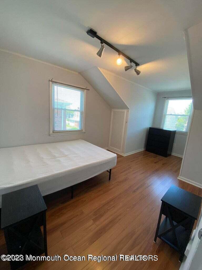 9 Howland Avenue Long Branch, NJ 07740 - Photo 14 of 18 a view of a room with wooden floor and a window