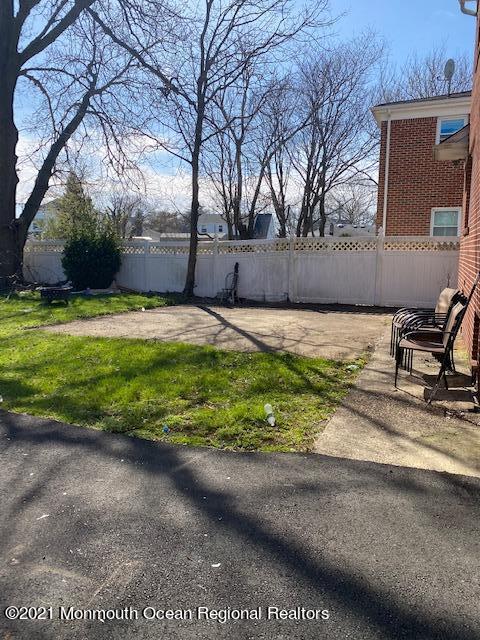 9 Howland Avenue Long Branch, NJ 07740 - Photo 17 of 18 a backyard of a house with yard and garage