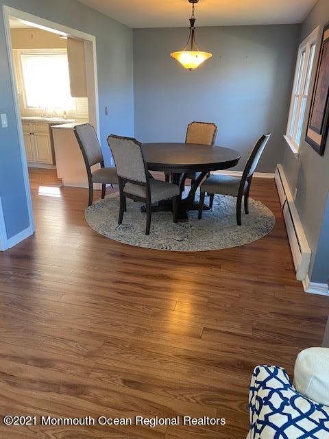 9 Howland Avenue Long Branch, NJ 07740 - Photo 4 of 18 a view of a dining room with furniture and wooden floor