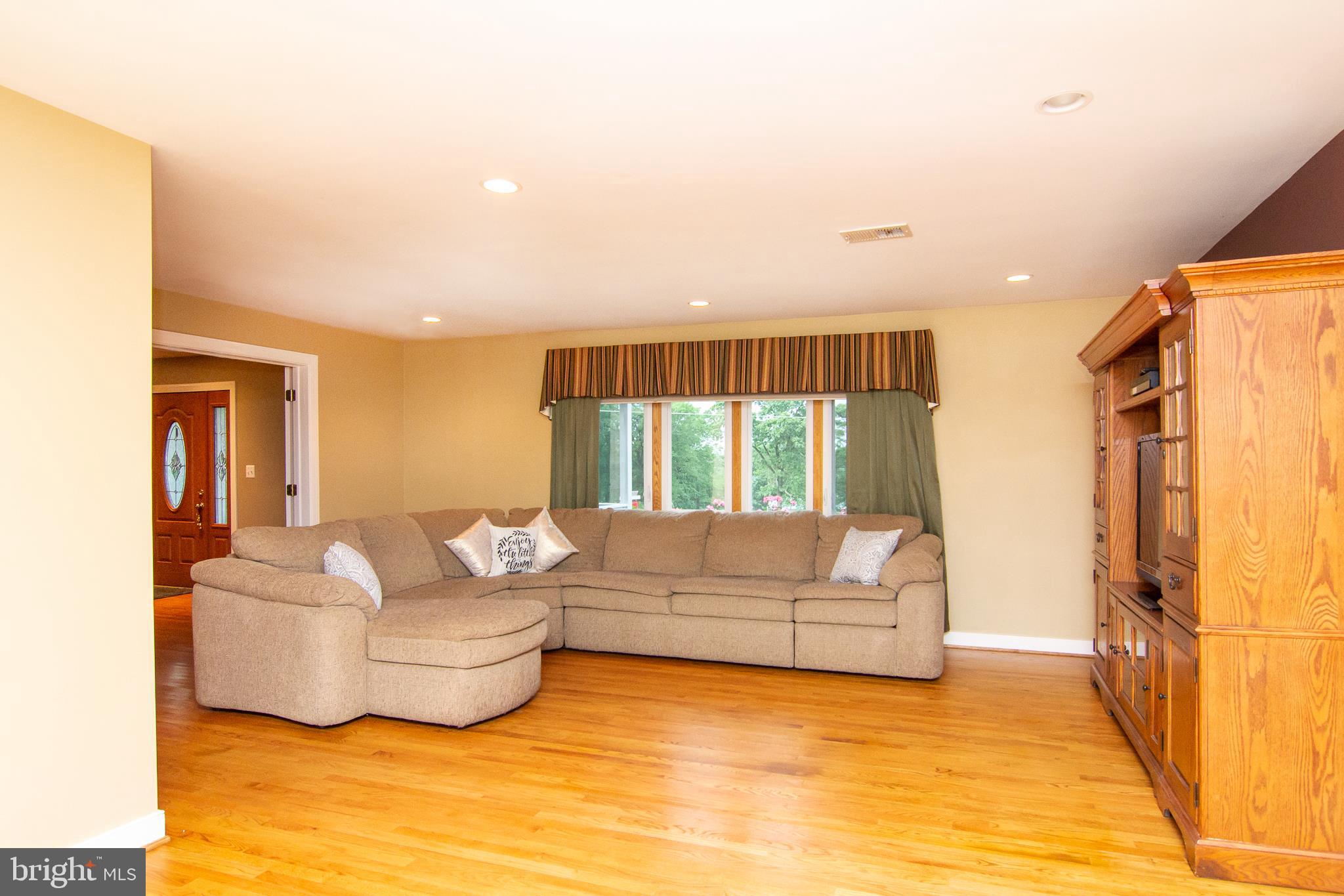 563 Oak Tree Road Westminster, MD 21157 - Photo 13 of 41 a living room with furniture and a large window