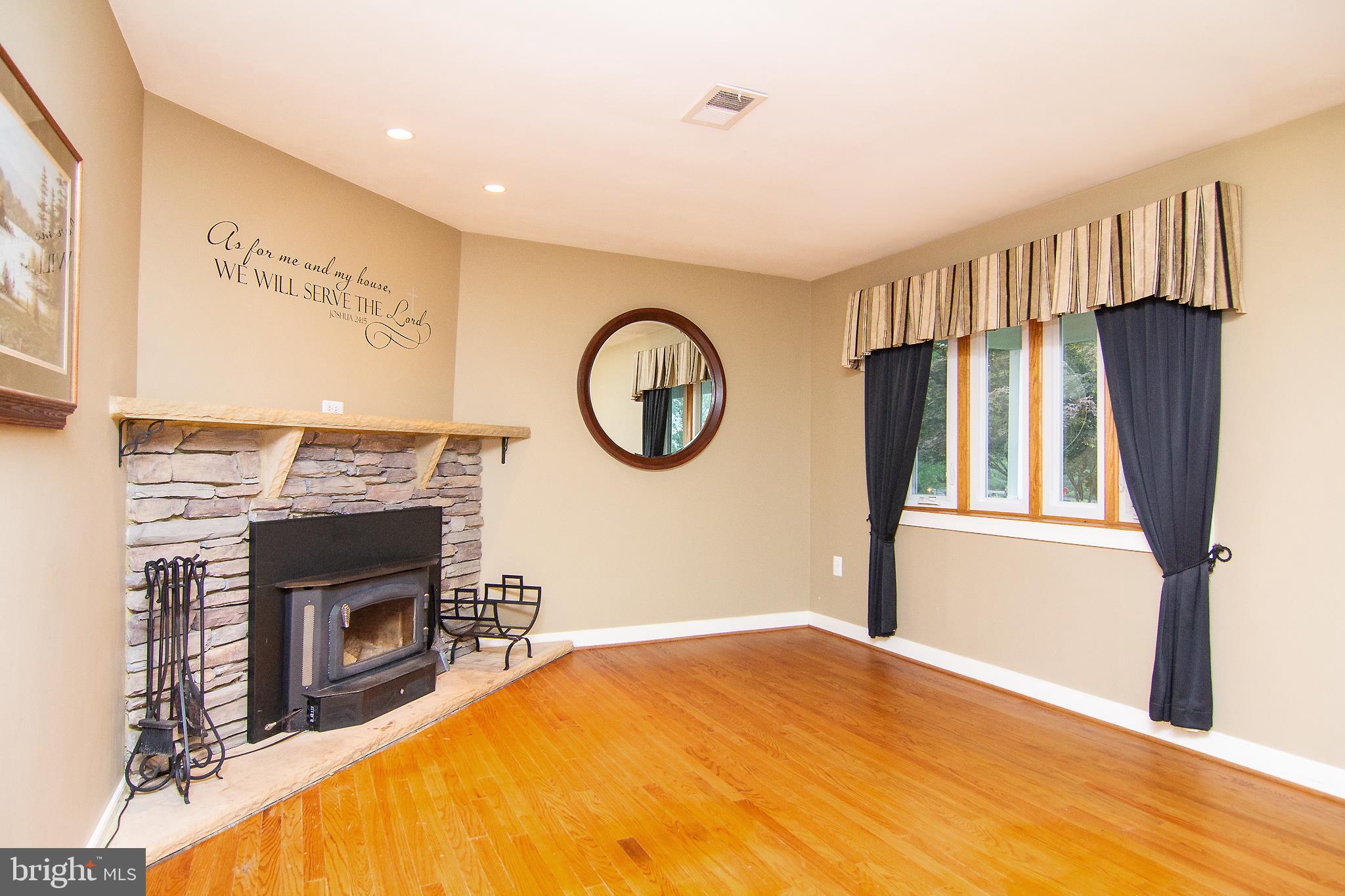 563 Oak Tree Road Westminster, MD 21157 - Photo 17 of 41 a view of a livingroom with a fireplace and a window