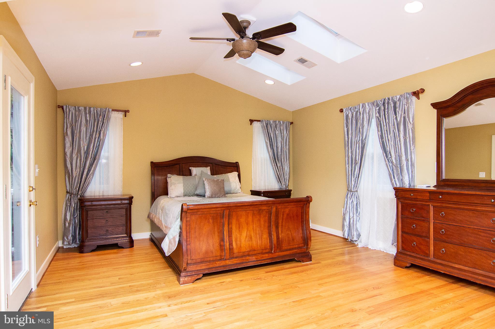 563 Oak Tree Road Westminster, MD 21157 - Photo 23 of 41 a spacious bedroom with a bed and a dresser