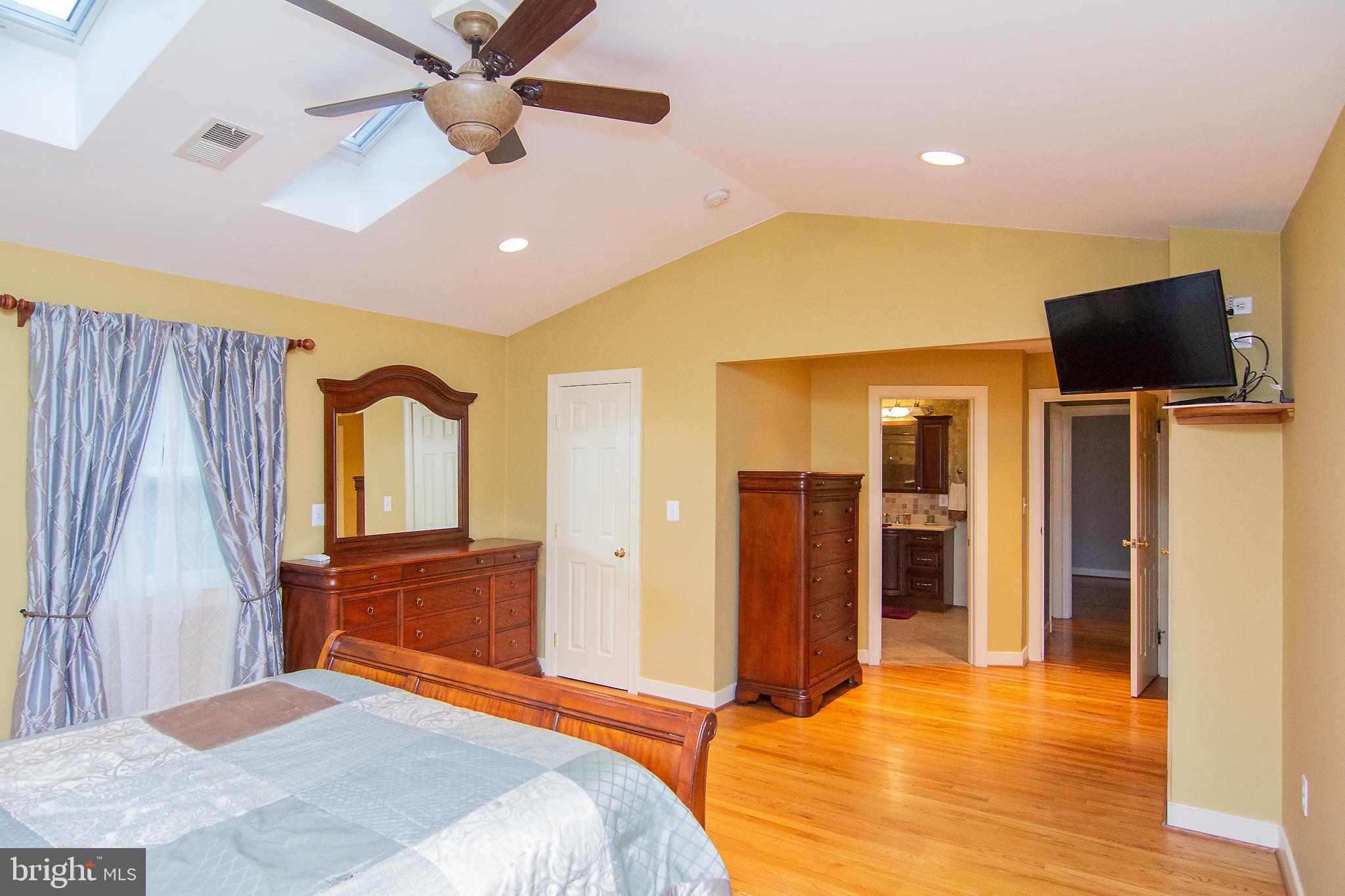 563 Oak Tree Road Westminster, MD 21157 - Photo 24 of 41 a bedroom with a bed and a flat screen tv