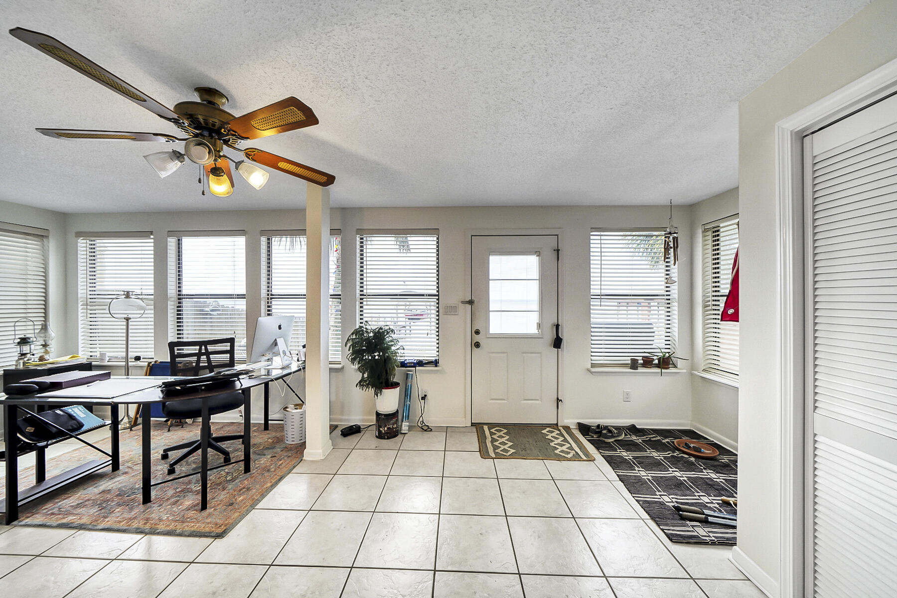 126 Walton Way, Unit 10 Miramar Beach, FL 32550 - Photo 12 of 28 a very nice looking room with a large window and chandelier