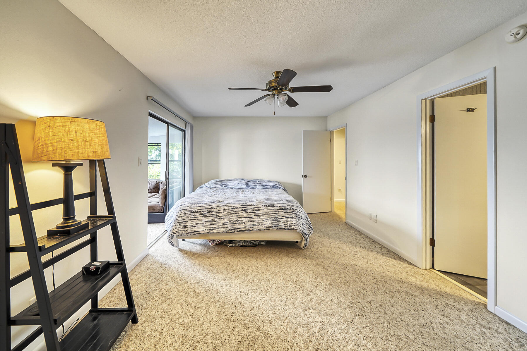 126 Walton Way, Unit 10 Miramar Beach, FL 32550 - Photo 15 of 28 a bedroom with a bed and a walk in closet