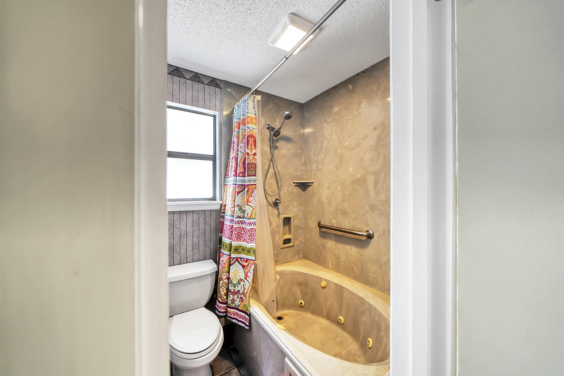 126 Walton Way, Unit 10 Miramar Beach, FL 32550 - Photo 21 of 28 a bathroom with a toilet and a bathtub