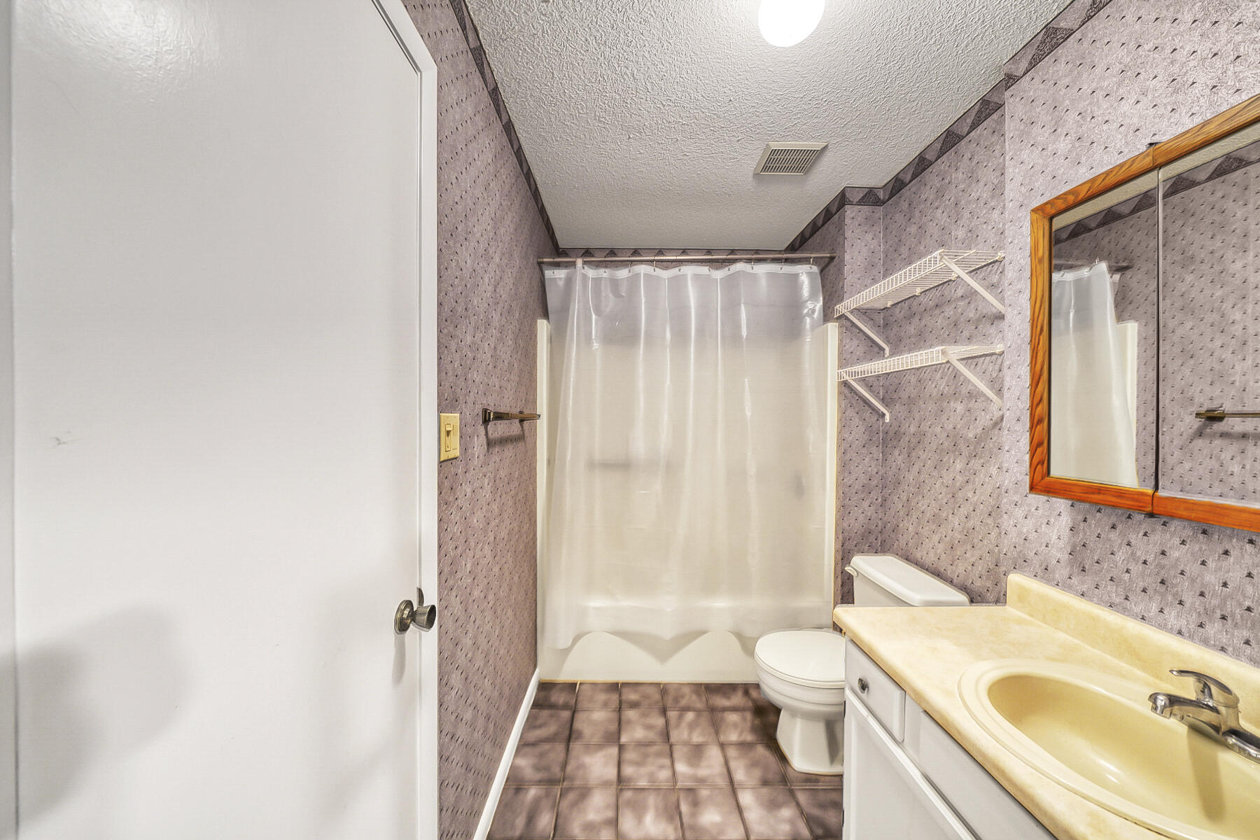 126 Walton Way, Unit 10 Miramar Beach, FL 32550 - Photo 24 of 28 a bathroom with a sink a toilet and shower