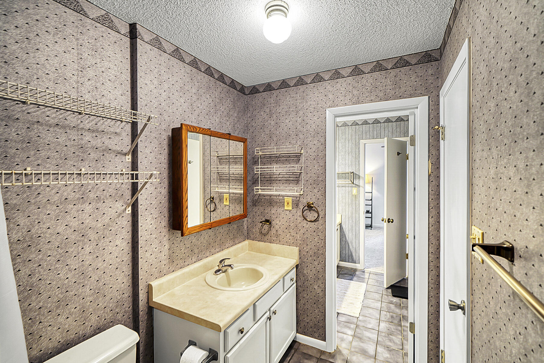 126 Walton Way, Unit 10 Miramar Beach, FL 32550 - Photo 25 of 28 a bathroom with a sink a mirror and a shower
