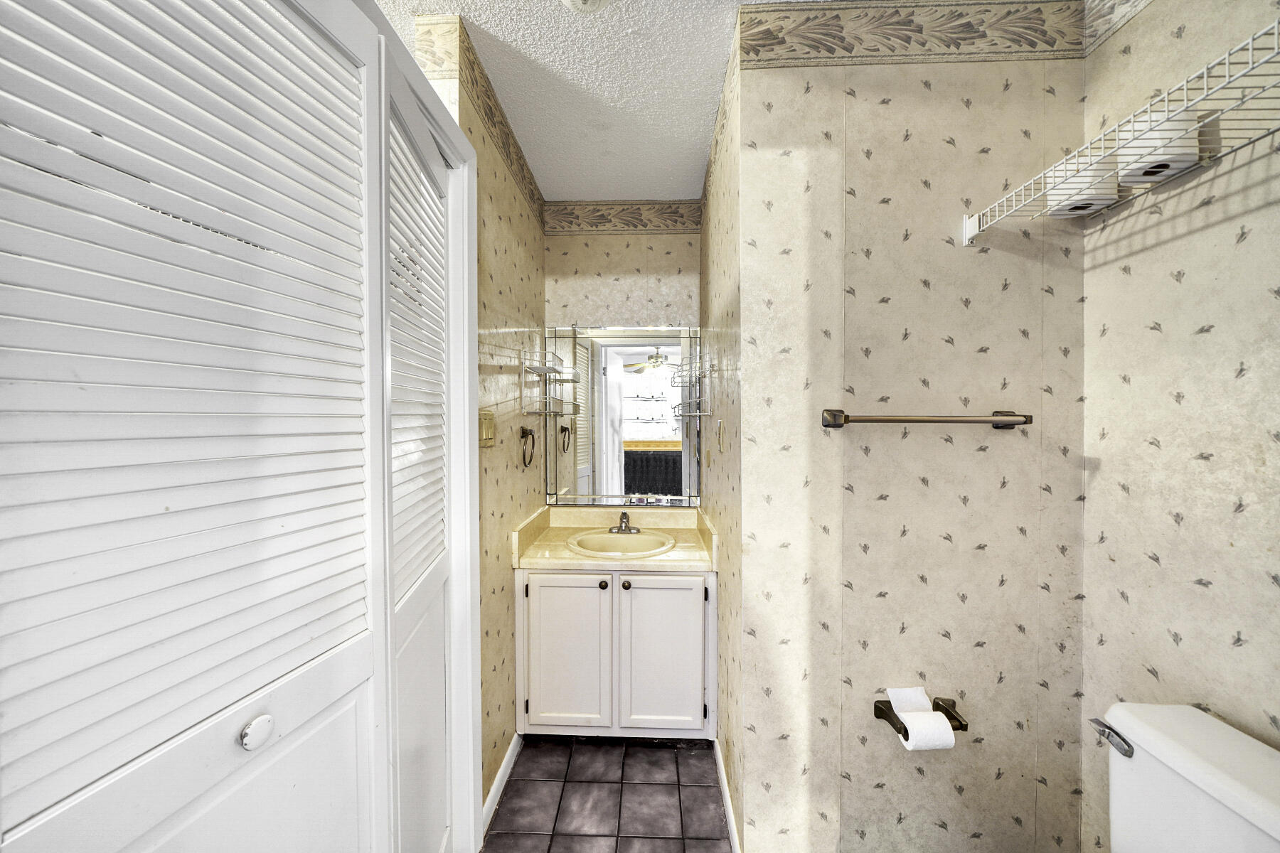 126 Walton Way, Unit 10 Miramar Beach, FL 32550 - Photo 26 of 28 a bathroom with a sink and a mirror