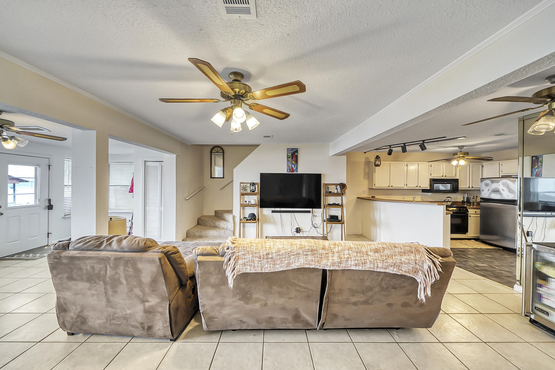 126 Walton Way, Unit 10 Miramar Beach, FL 32550 - Photo 7 of 28 a living room with couches and a flat screen tv