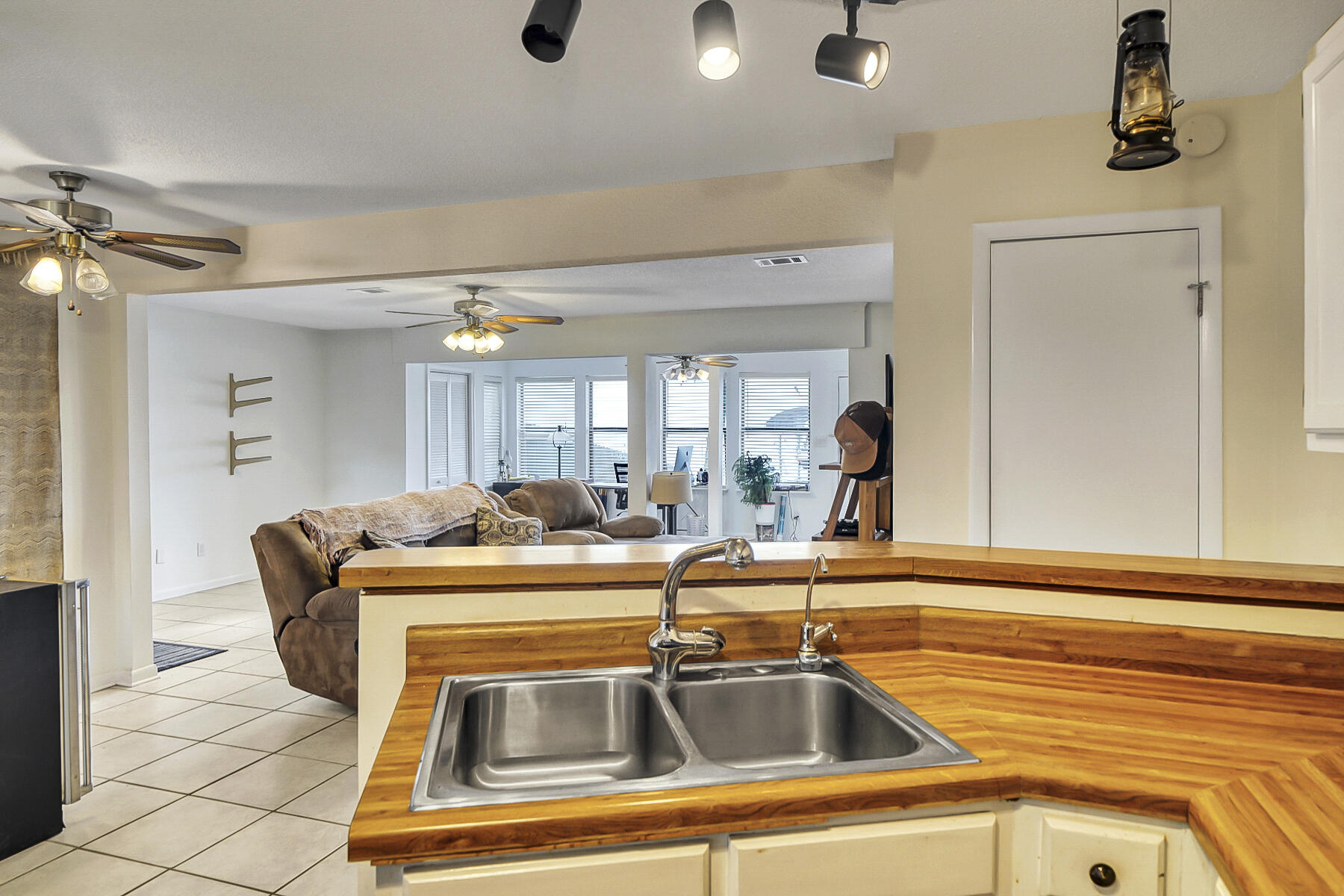 126 Walton Way, Unit 10 Miramar Beach, FL 32550 - Photo 10 of 28 a kitchen with a sink and a refrigerator