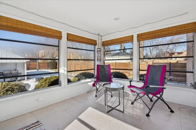 a work room with furniture and a window
