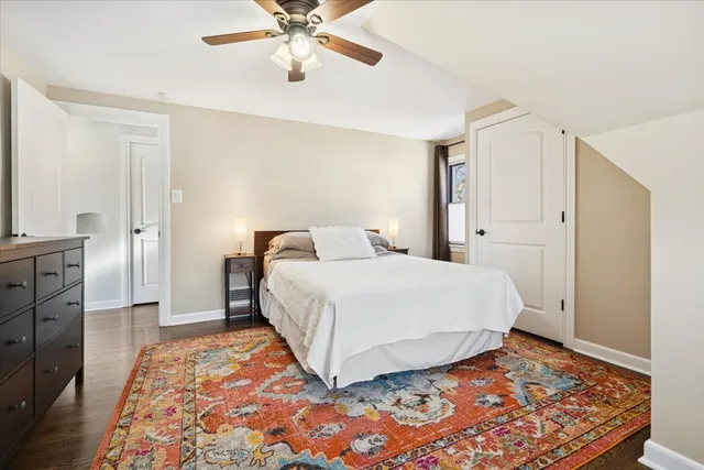 a bedroom with a bed and a mirror