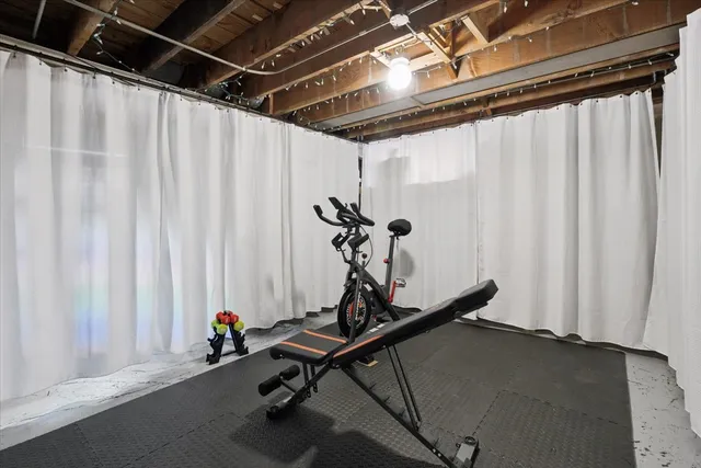 a room with gym equipment and a window