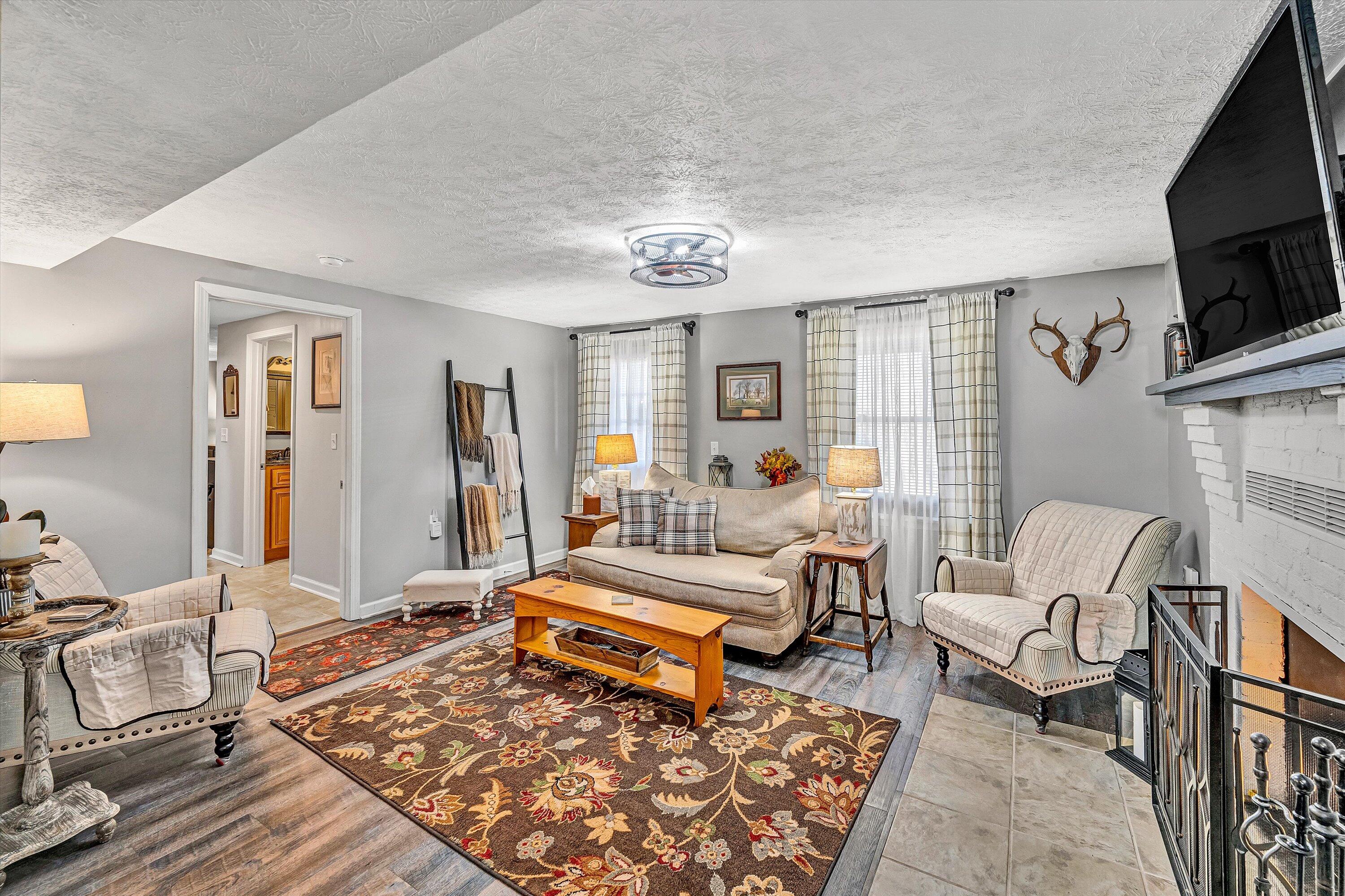 1620 Ayers Road Moneta, VA 24121 - Photo 34 of 63 a living room with furniture and a flat screen tv