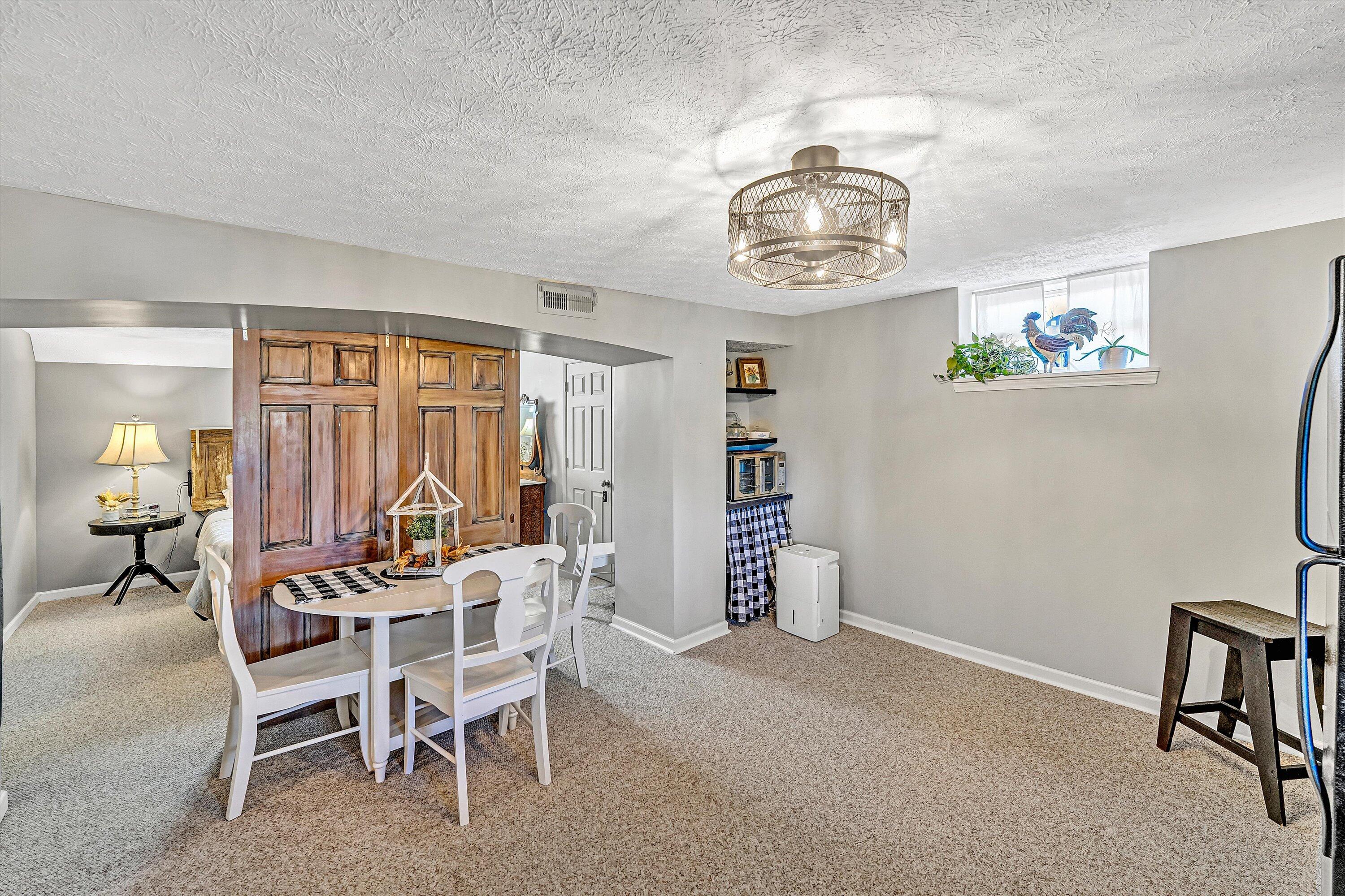 1620 Ayers Road Moneta, VA 24121 - Photo 41 of 63 a dining room with furniture and a window