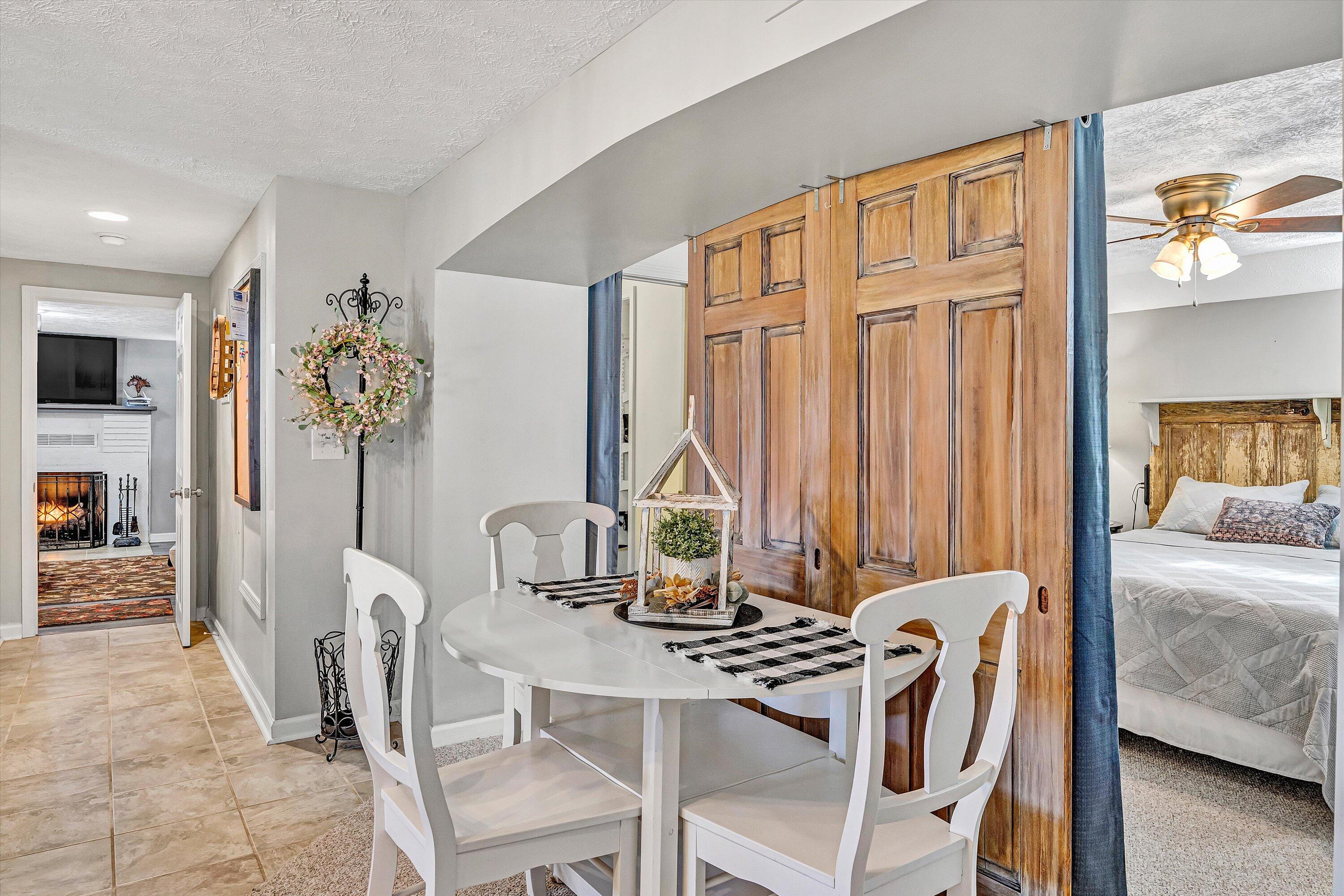 1620 Ayers Road Moneta, VA 24121 - Photo 45 of 63 a dining room with furniture and a chandelier