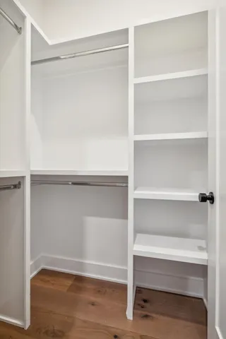 a kitchen that has a lot of cabinets stainless steel appliances and a counter space