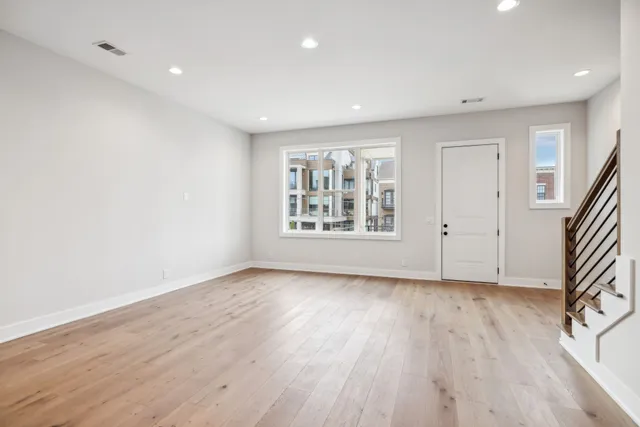 a view of wooden floor in an empty room