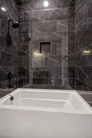 an empty room with wooden floor and window